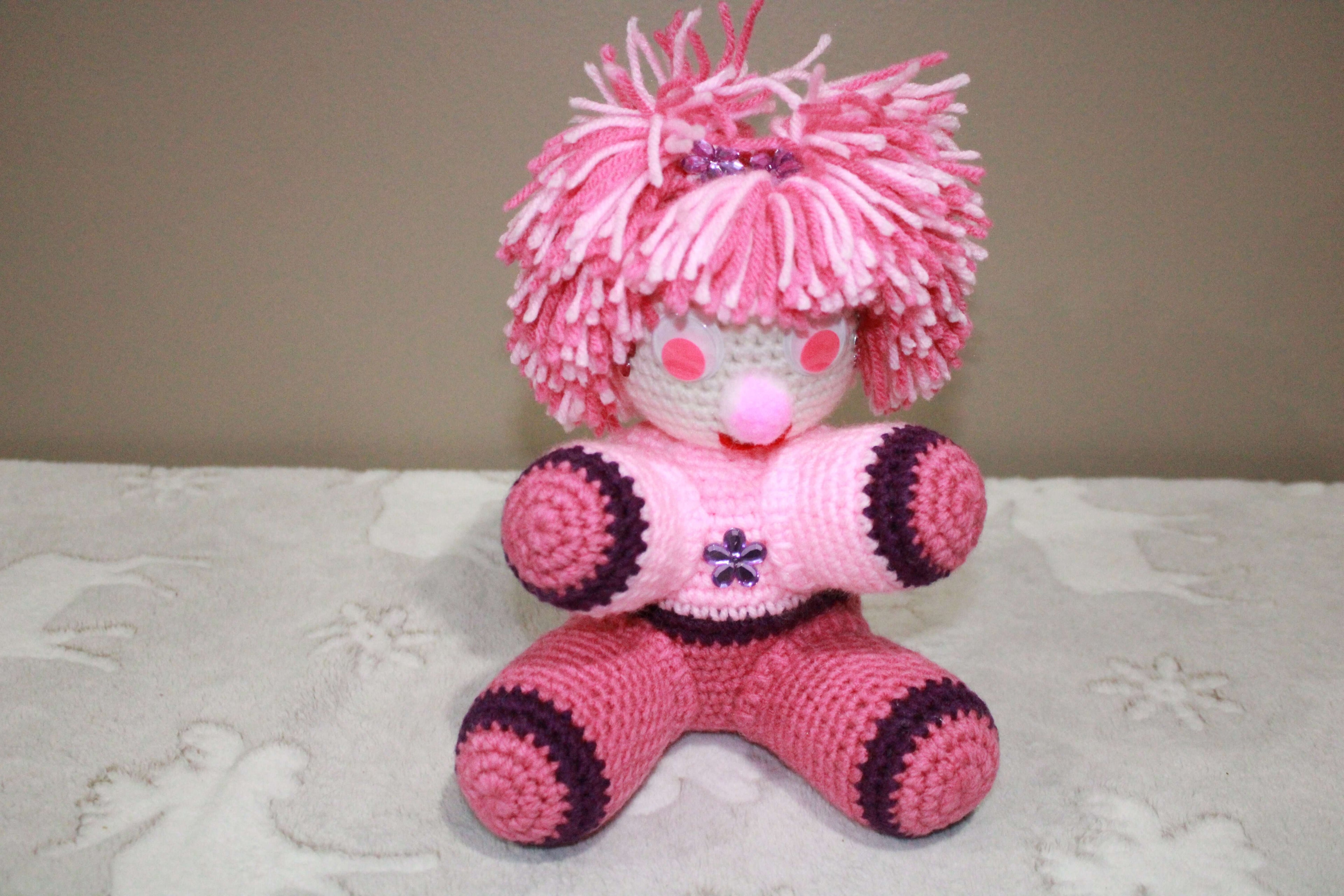 Pink Pom Pom Girl crafted with handmade techniques for a truly unique style.