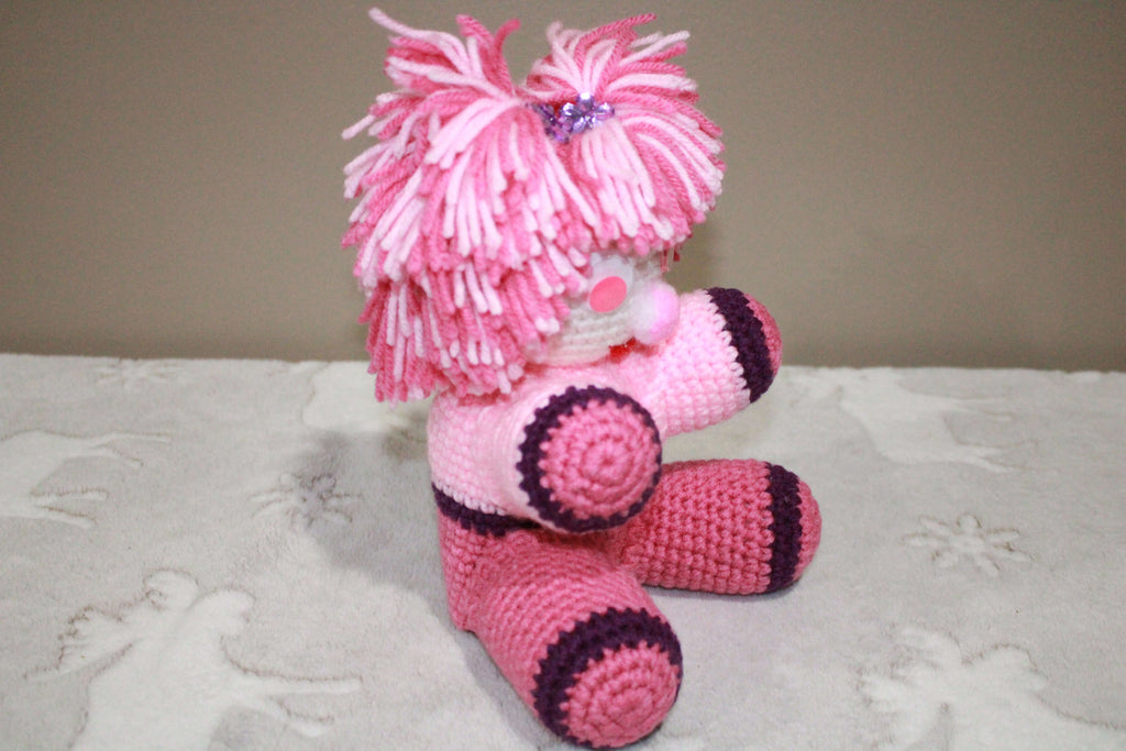 Pink Pom Pom Girl crafted with handmade techniques for a truly unique style.