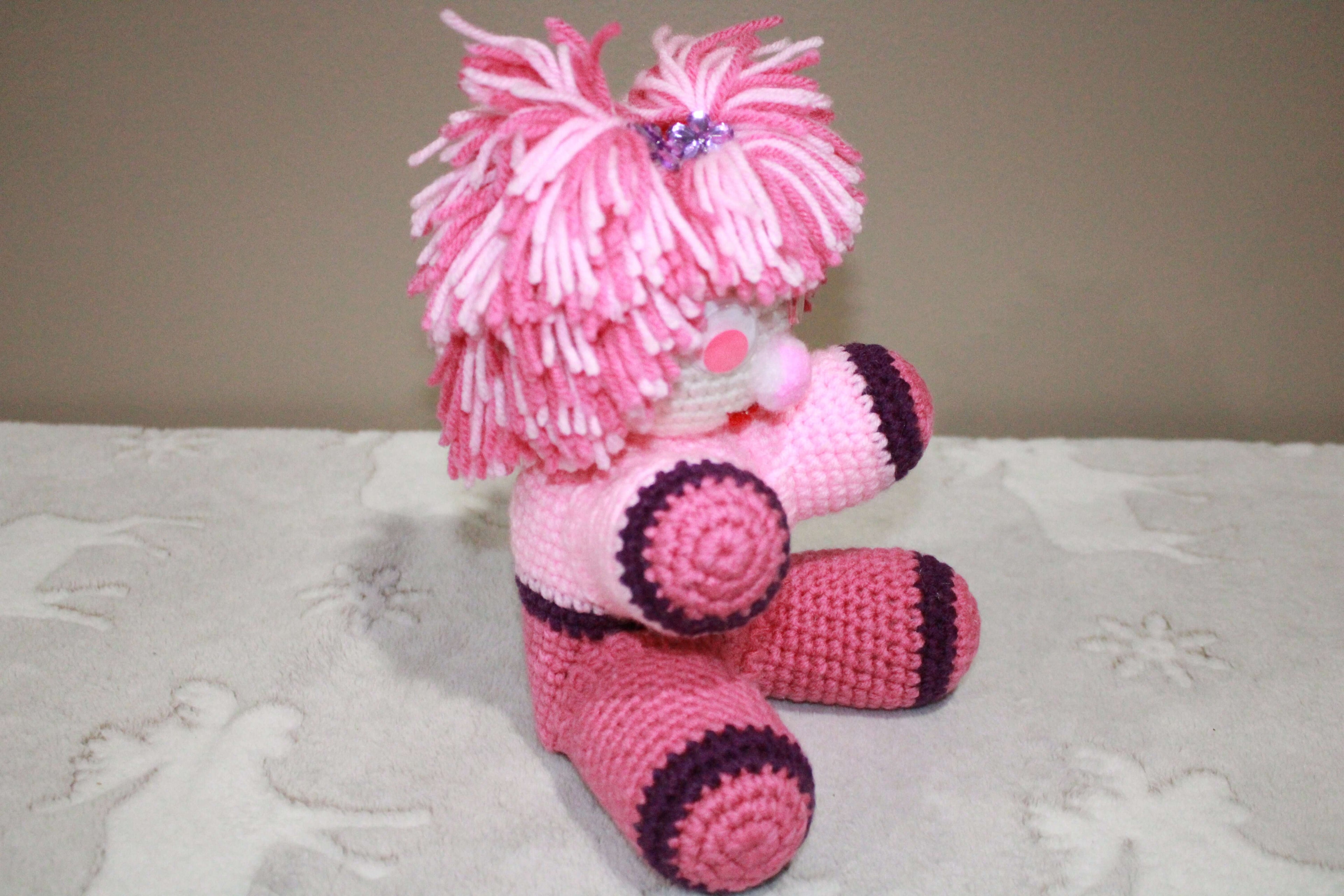 Pink Pom Pom Girl crafted with handmade techniques for a truly unique style.