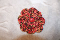 Ladybug Fashion Flower crafted with handmade techniques for a truly unique style.