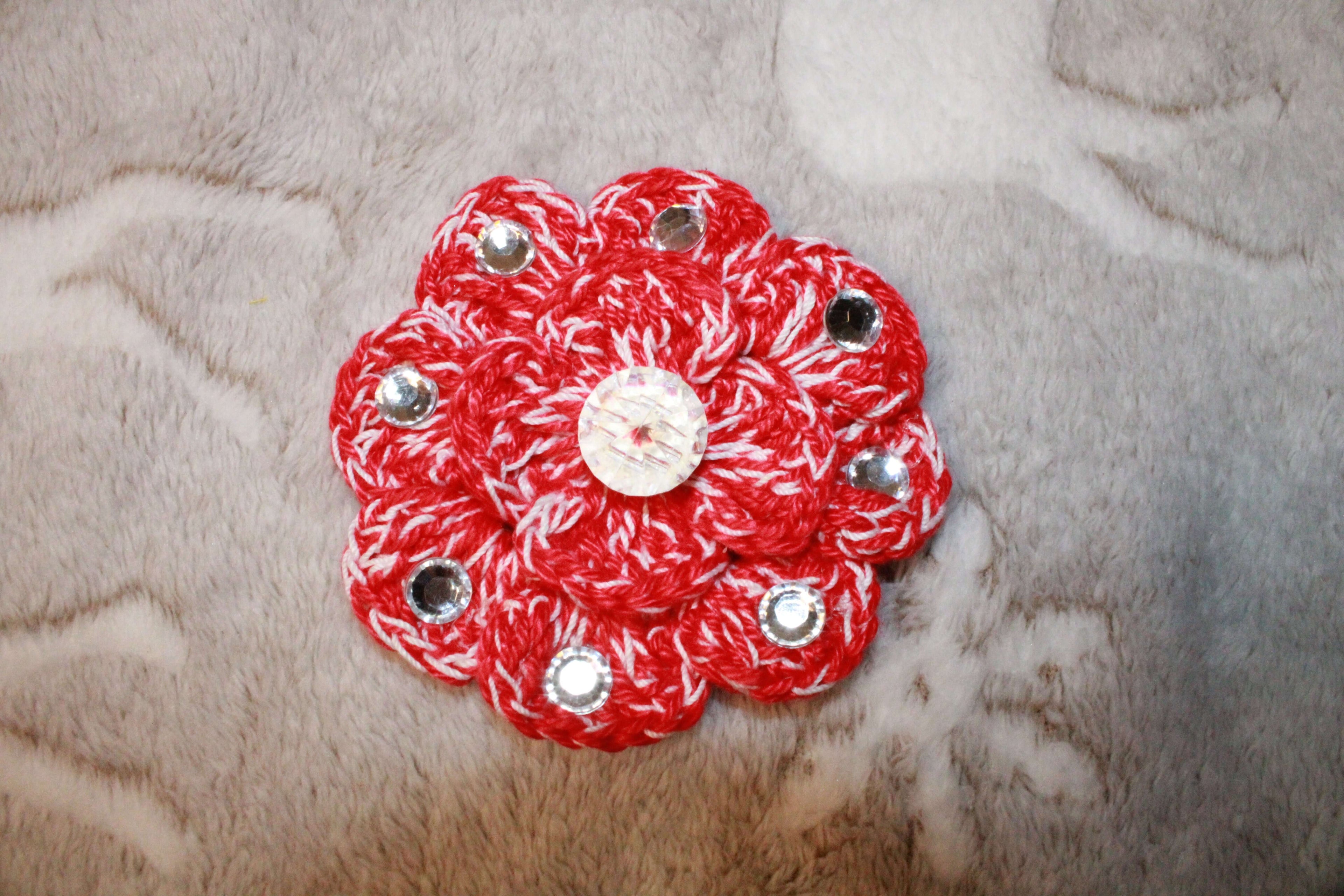 Red And White Fashion Hairclip Flower crafted with handmade techniques for a truly unique style.