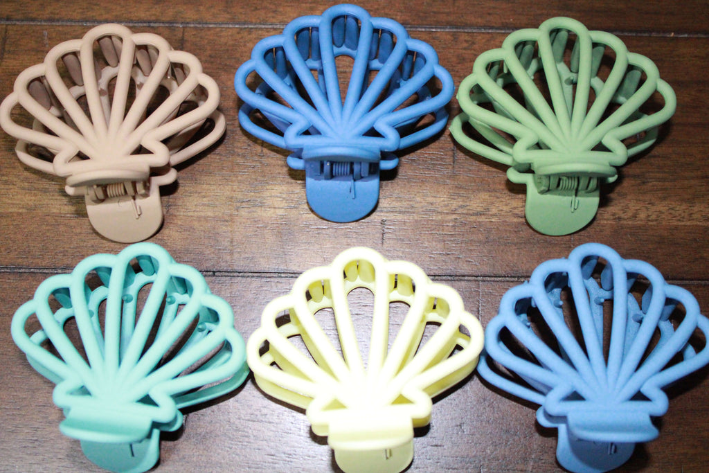 Stylish Cute Caribbean Clam Hair Claw Clips Strong Hold featuring unique designs, perfect for adding a touch of flair to any hairstyle.