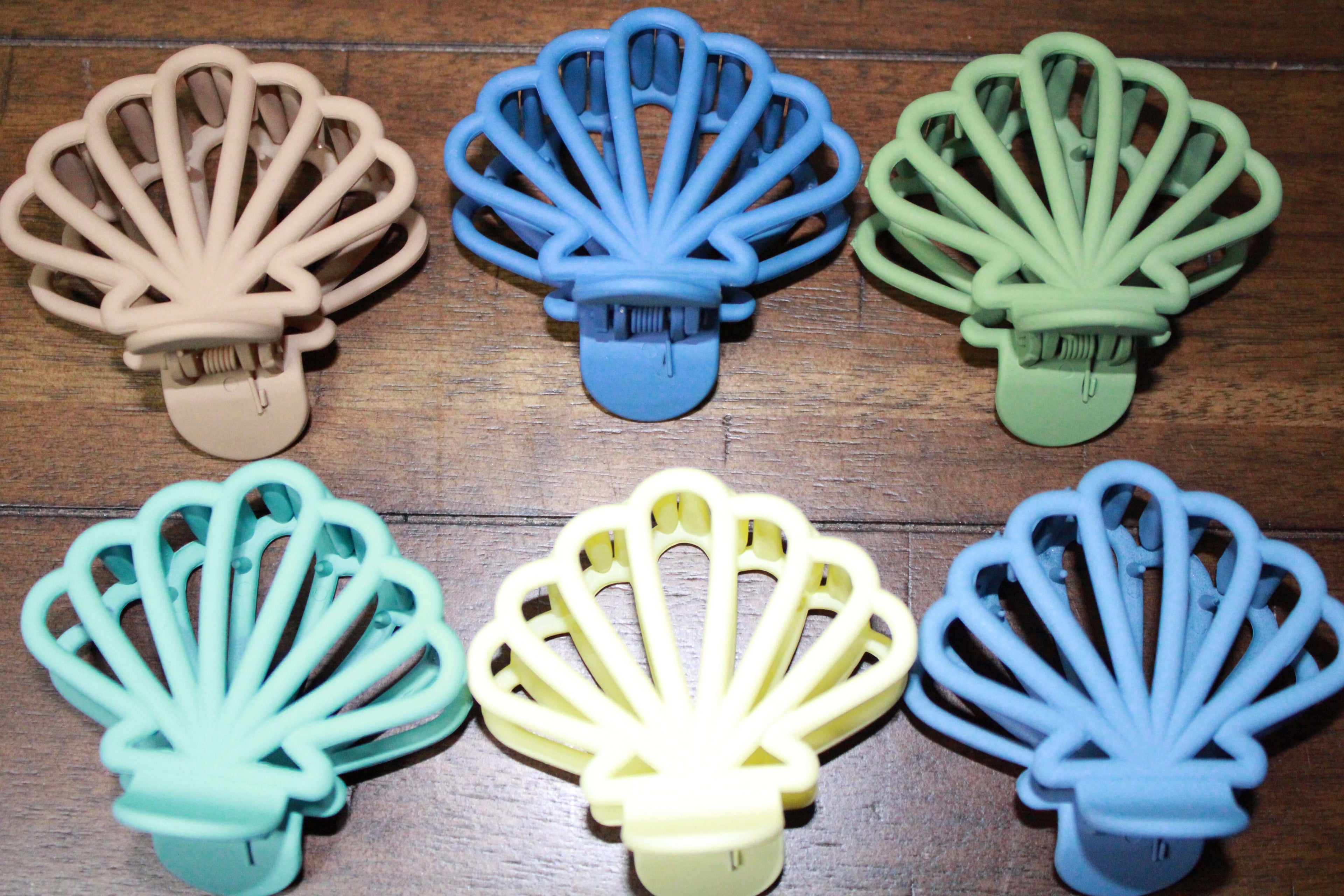 Stylish Cute Caribbean Clam Hair Claw Clips Strong Hold featuring unique designs, perfect for adding a touch of flair to any hairstyle.