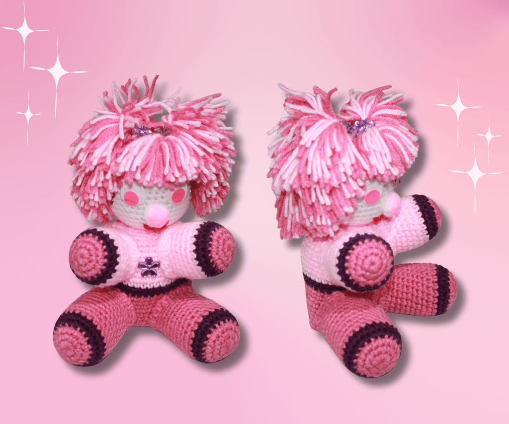 Pink Pom Pom Girl crafted with handmade techniques for a truly unique style.